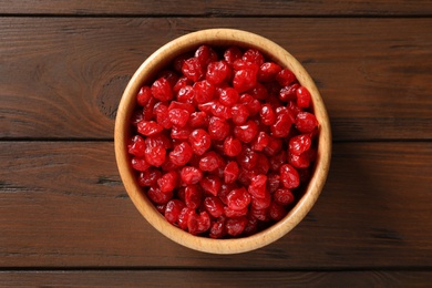 Photo of Bowl of sweet cherries on table, top view. Dried fruit as healthy snack