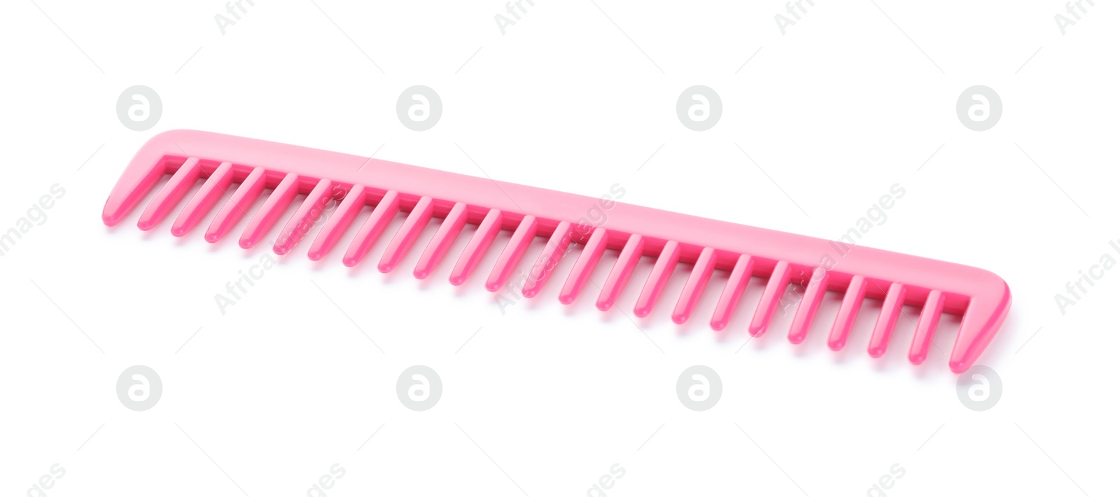 Photo of New pink hair comb isolated on white