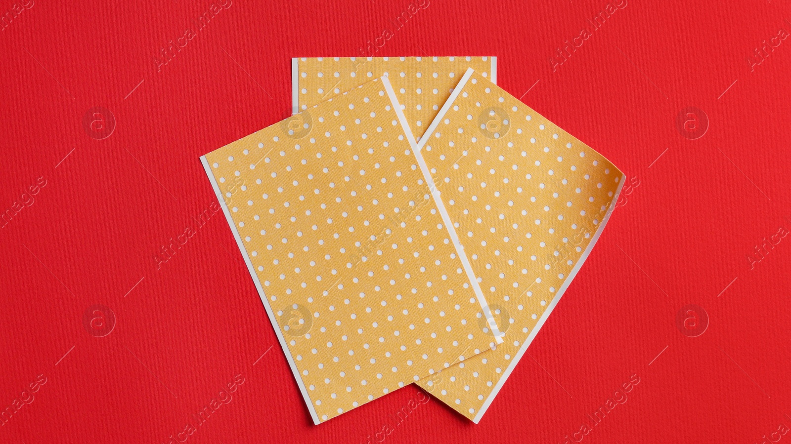 Photo of Pepper plasters on red background, flat lay