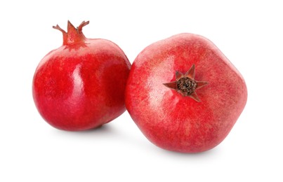 Photo of Two fresh ripe pomegranates isolated on white