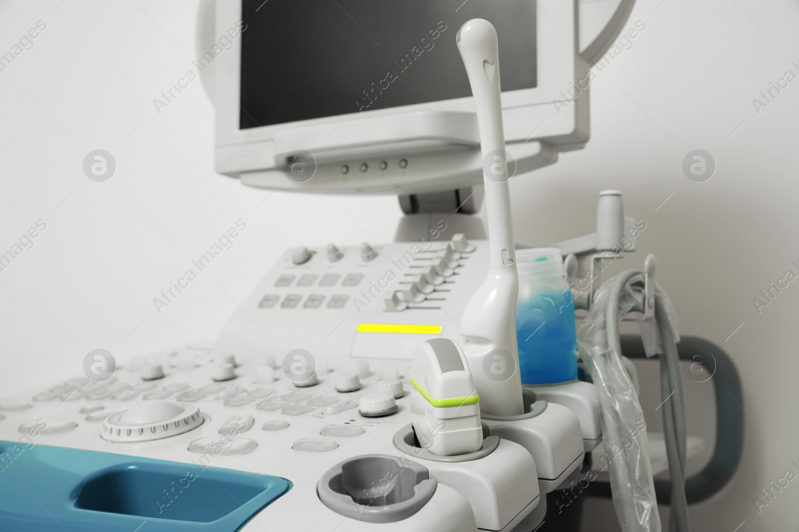 Photo of One ultrasound machine near white wall, closeup