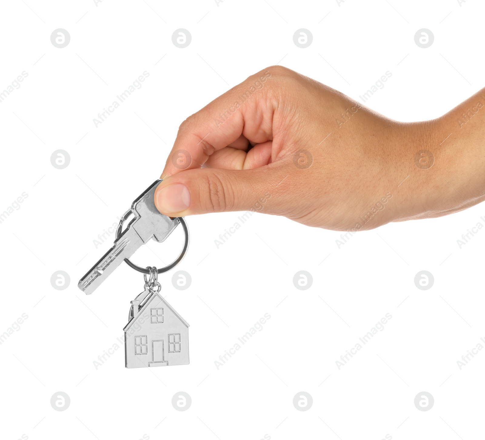 Photo of Woman holding key with metallic keychain in shape of house on white background, closeup