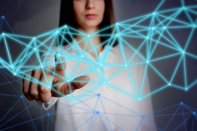 Woman using virtual screen with connection lines presenting innovation network linkage on color background