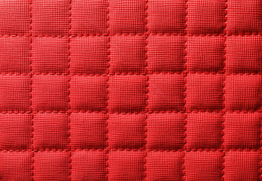 Texture of red leather as background, closeup