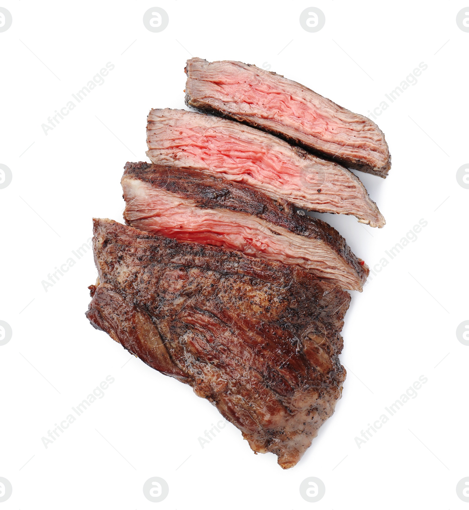 Photo of Pieces of tasty grilled beef meat isolated on white, top view