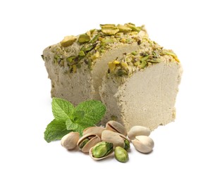 Image of Tasty halva, pistachio nuts and mint leaves isolated on white