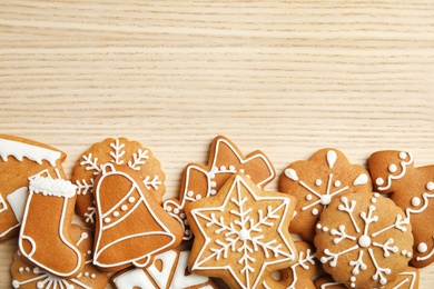 Tasty homemade Christmas cookies on wooden background, top view