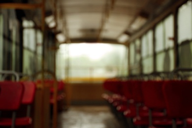 Photo of Blurred view of tram with red seats inside