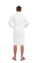 Man wearing bathrobe on white background, back view