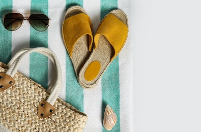 Composition with stylish beach accessories on white background, top view