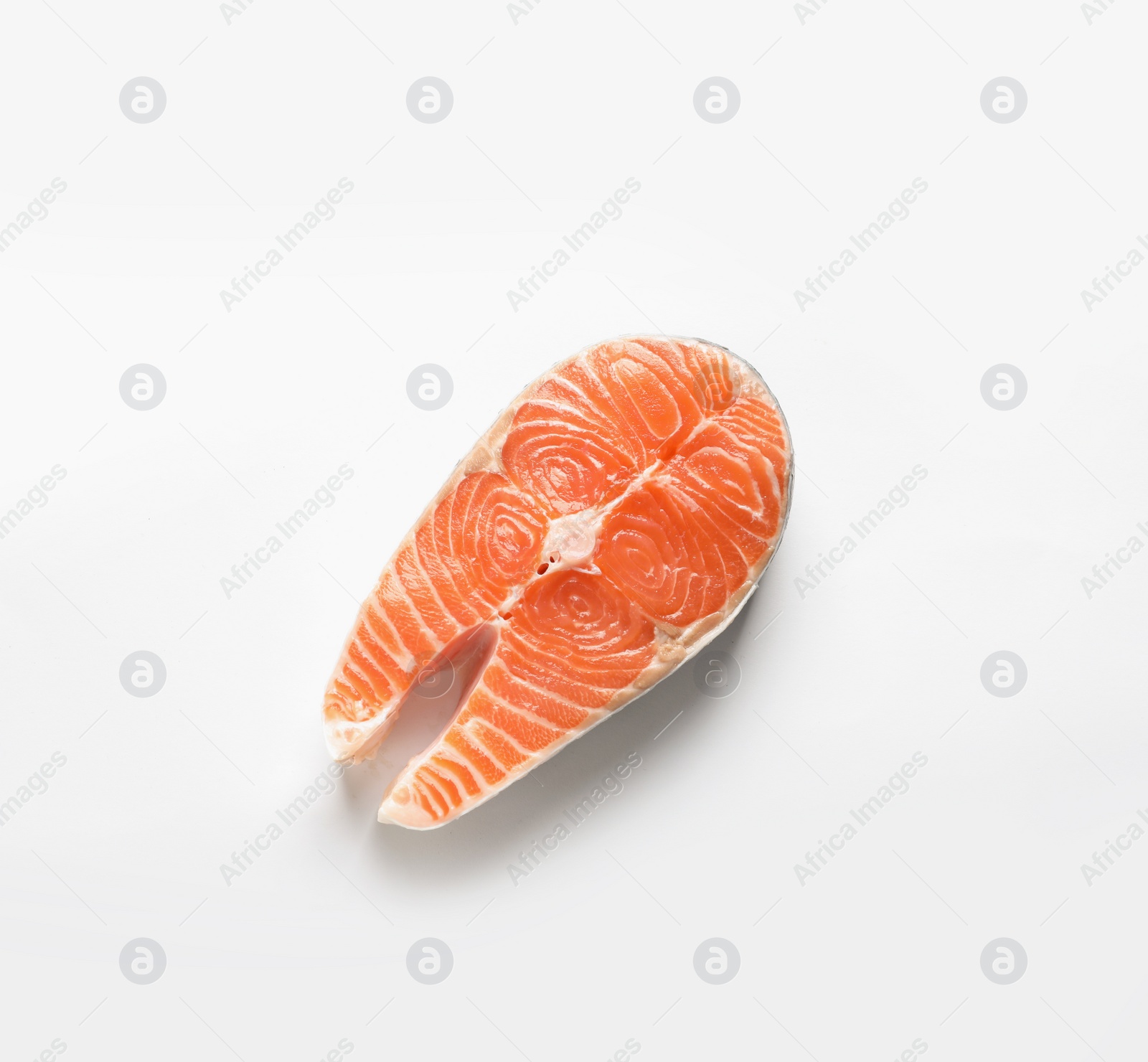 Photo of Raw salmon steak on white background, top view. Natural food high in protein