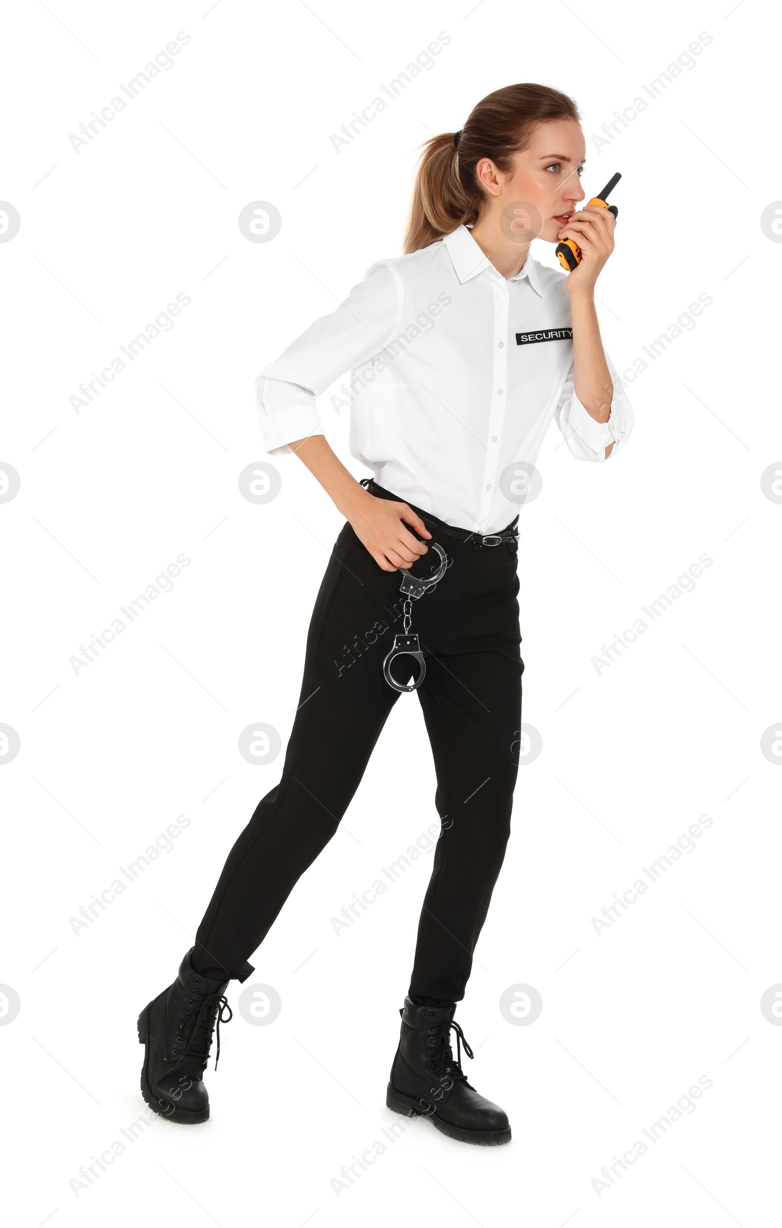 Photo of Female security guard in uniform using portable radio transmitter on white background