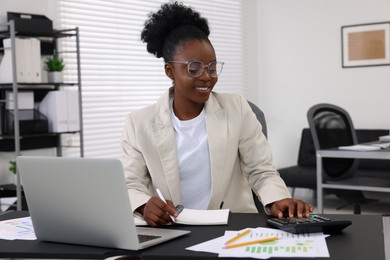 Photo of Professional accountant working at desk in office