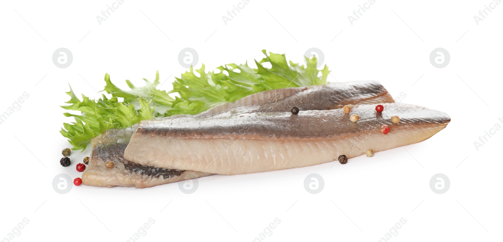 Photo of Delicious salted herring fillets with lettuce and peppercorns on white background