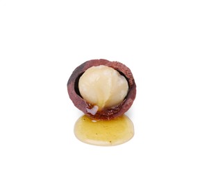 Photo of Delicious organic Macadamia nut isolated on white