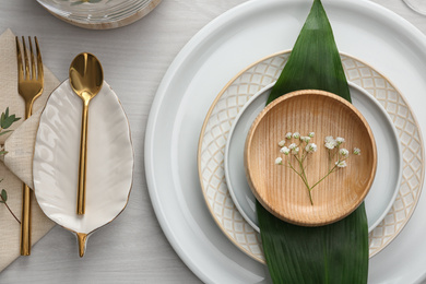 Elegant festive setting on white wooden table, flat lay