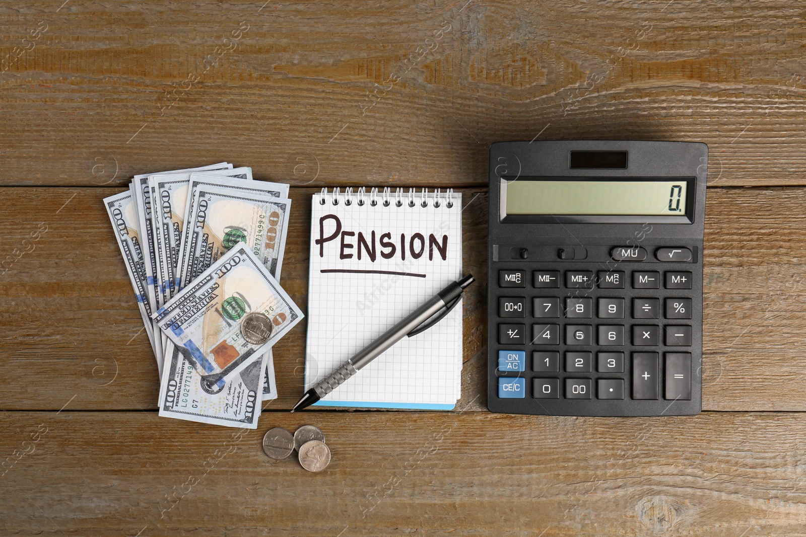 Photo of Calculator, dollar banknotes, coins, pen and notebook with word Pension on wooden table, flat lay. Retirement concept