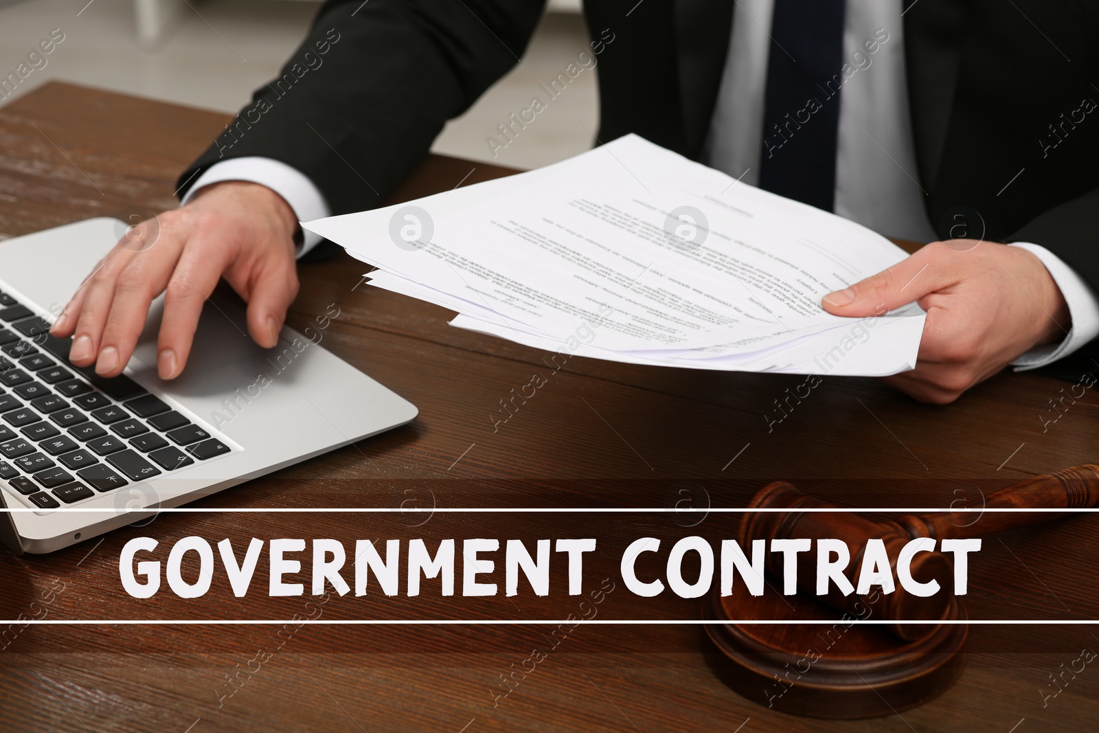 Image of Government contract. Man reading document at wooden table, closeup