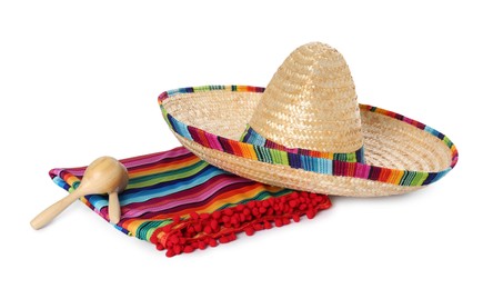 Mexican sombrero hat, maracas and colorful poncho isolated on white