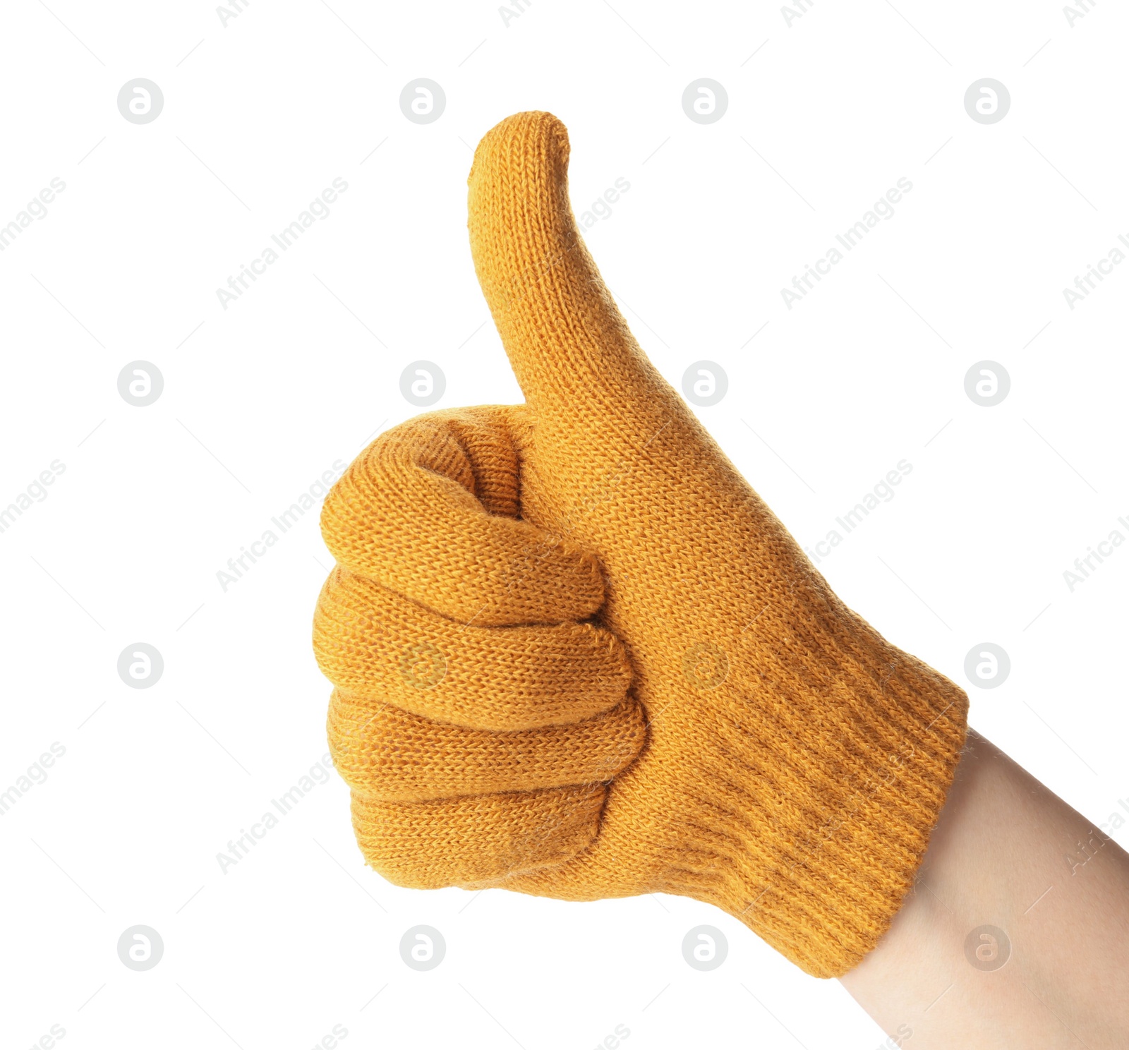 Photo of Woman in yellow woolen glove showing thumb up gesture on white background, closeup. Winter clothes