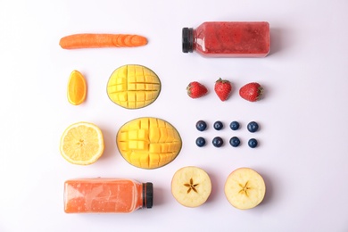 Flat lay composition with healthy detox smoothies and ingredients on light background