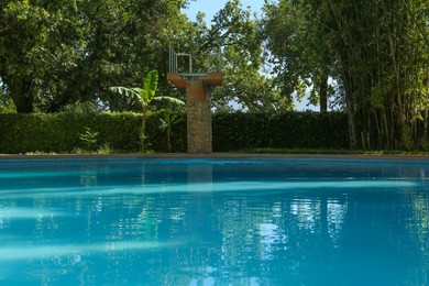 Photo of Pool with clear water and trees outdoors