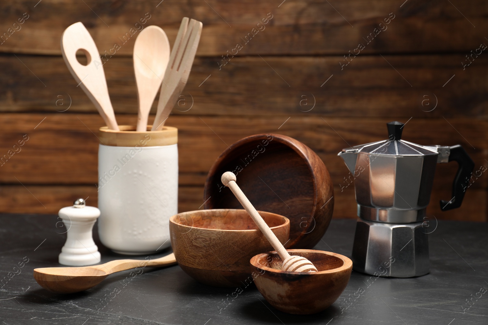 Photo of Set of different kitchen utensils on grey table