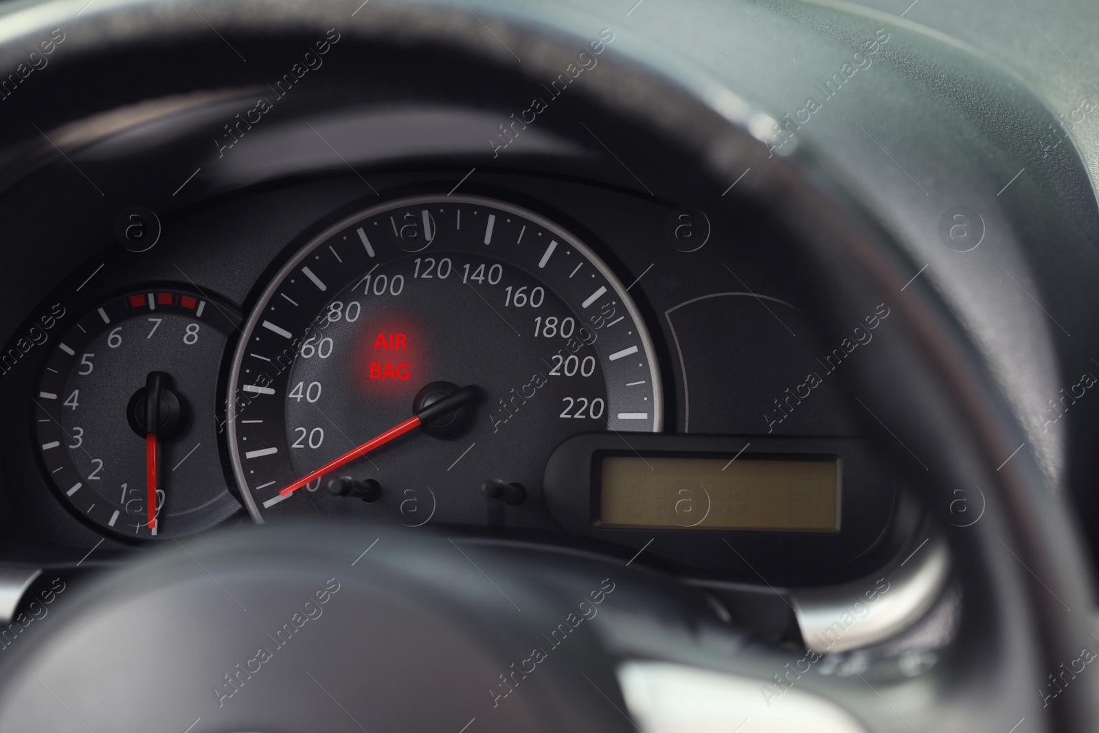 Image of Closeup view of dashboard with warning icon check airbag system in car