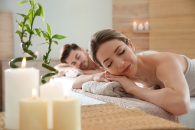 Romantic young couple relaxing in spa salon