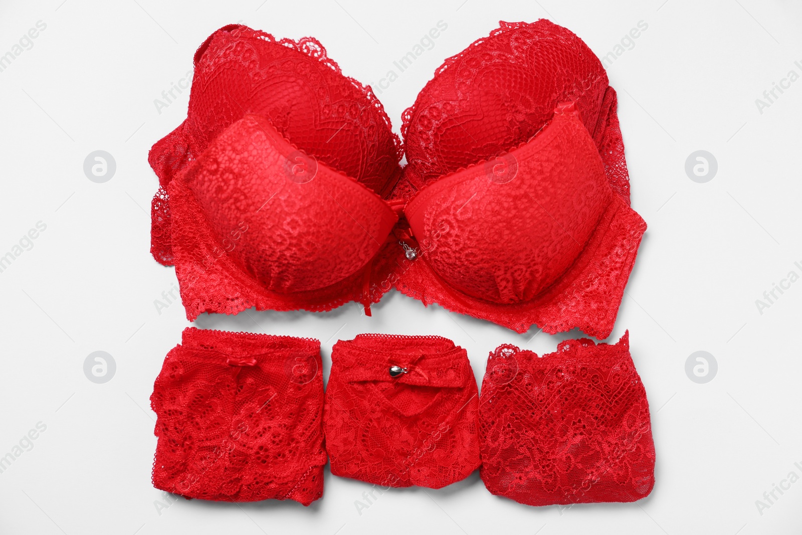 Photo of Stylish red women's underwear on white background, flat lay