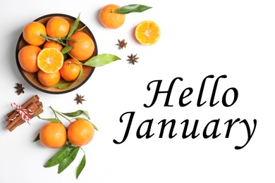 Image of Greeting card with text Hello January. Ripe tangerines, cinnamon sticks and anise stars on white background, flat lay