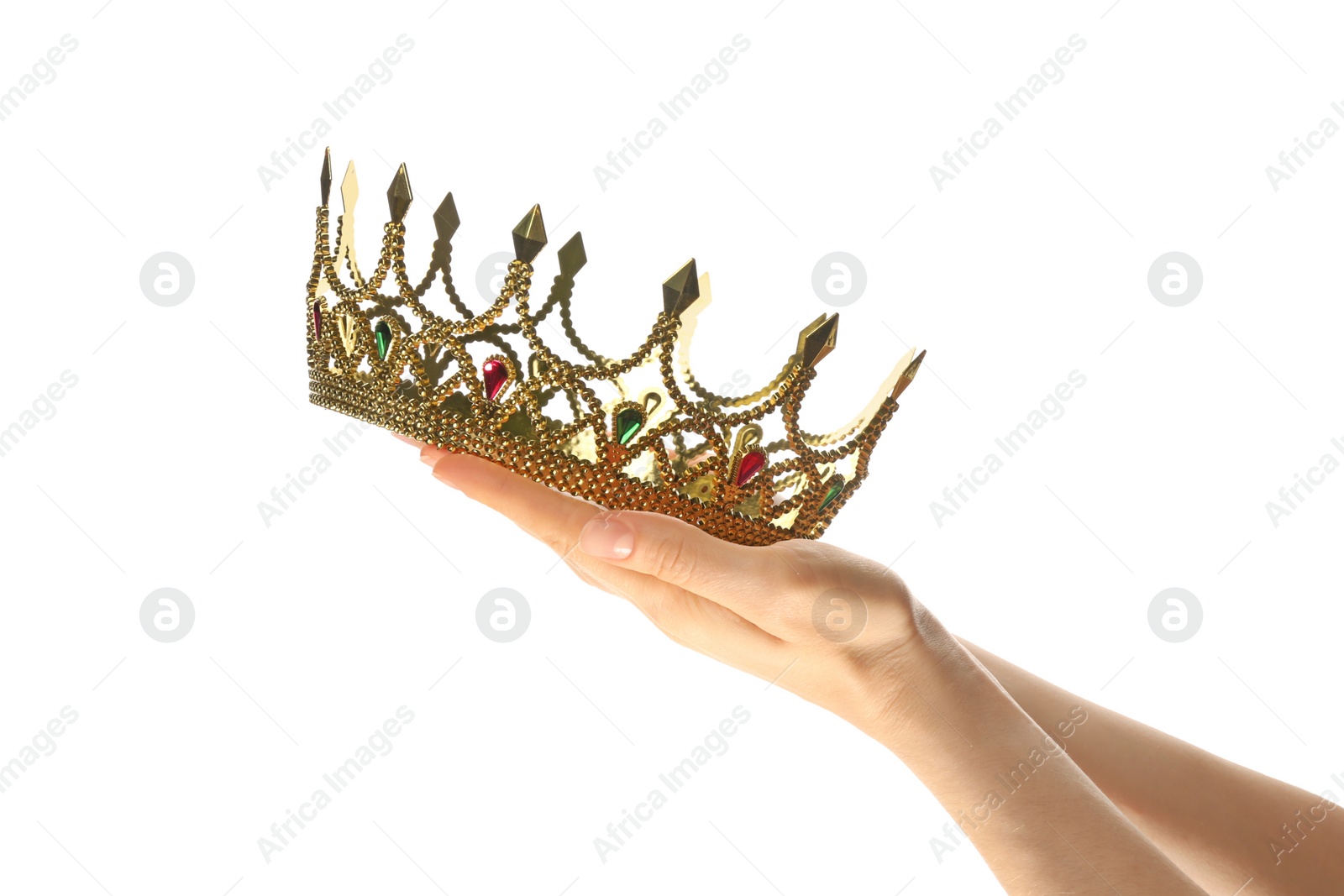 Photo of Woman holding beautiful golden crown on white background, closeup. Fantasy item