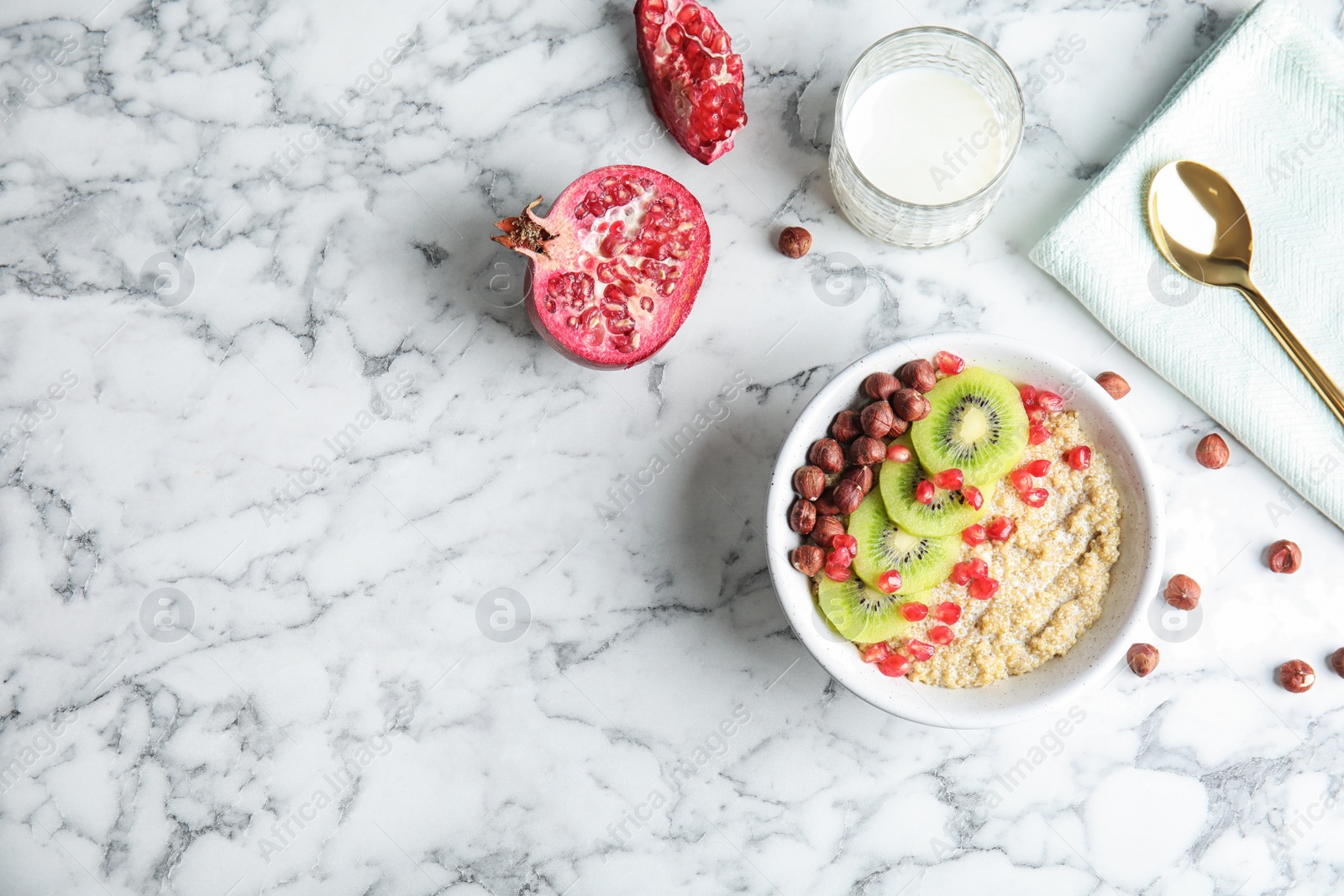 Photo of Flat lay composition with quinoa porridge, milk and space for text on marble background. Tasty breakfast