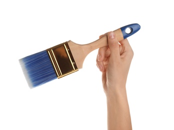 Woman holding paint brush on white background, closeup