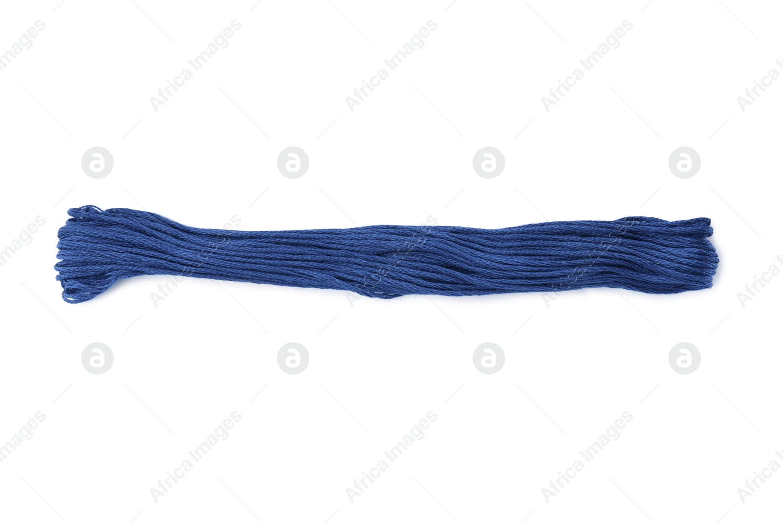 Photo of Bright blue embroidery thread on white background