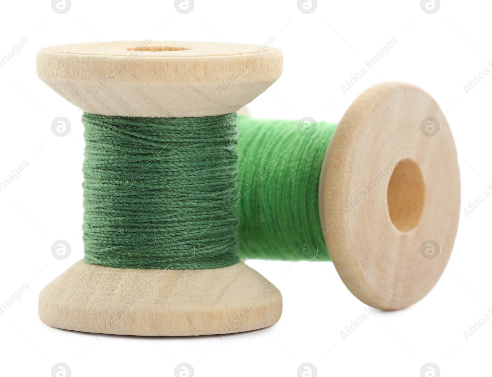 Photo of Different colorful sewing threads on white background, closeup