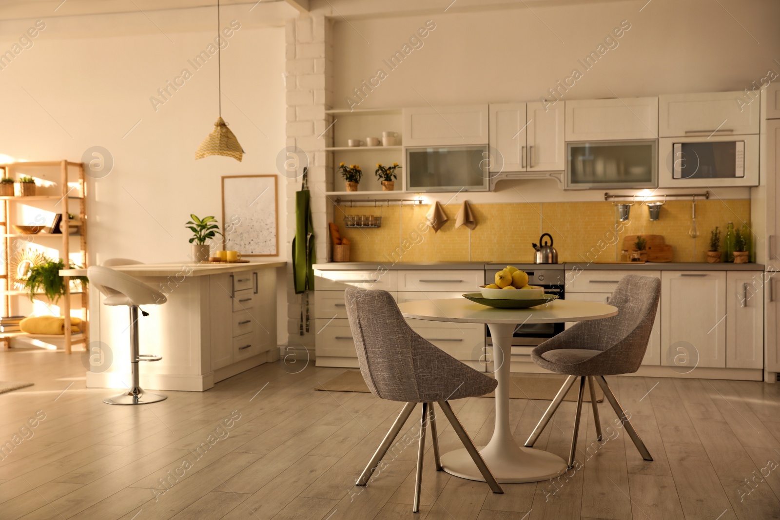 Photo of Modern kitchen interior with stylish white furniture