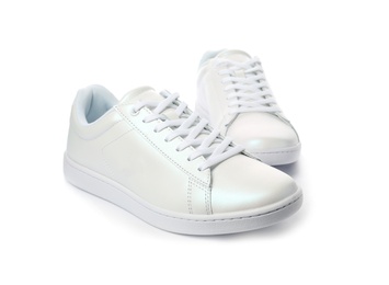 Pair of trendy sneakers on white background