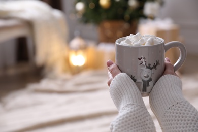 Photo of Woman with delicious hot drink at home, closeup. Space for text