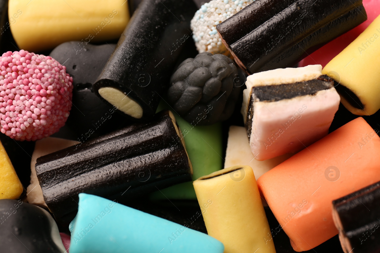 Photo of Many different liquorice candies as background, closeup