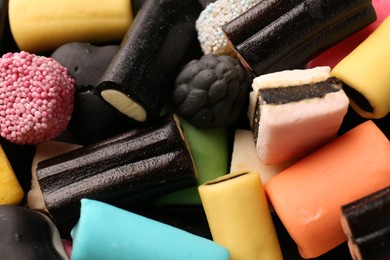 Photo of Many different liquorice candies as background, closeup