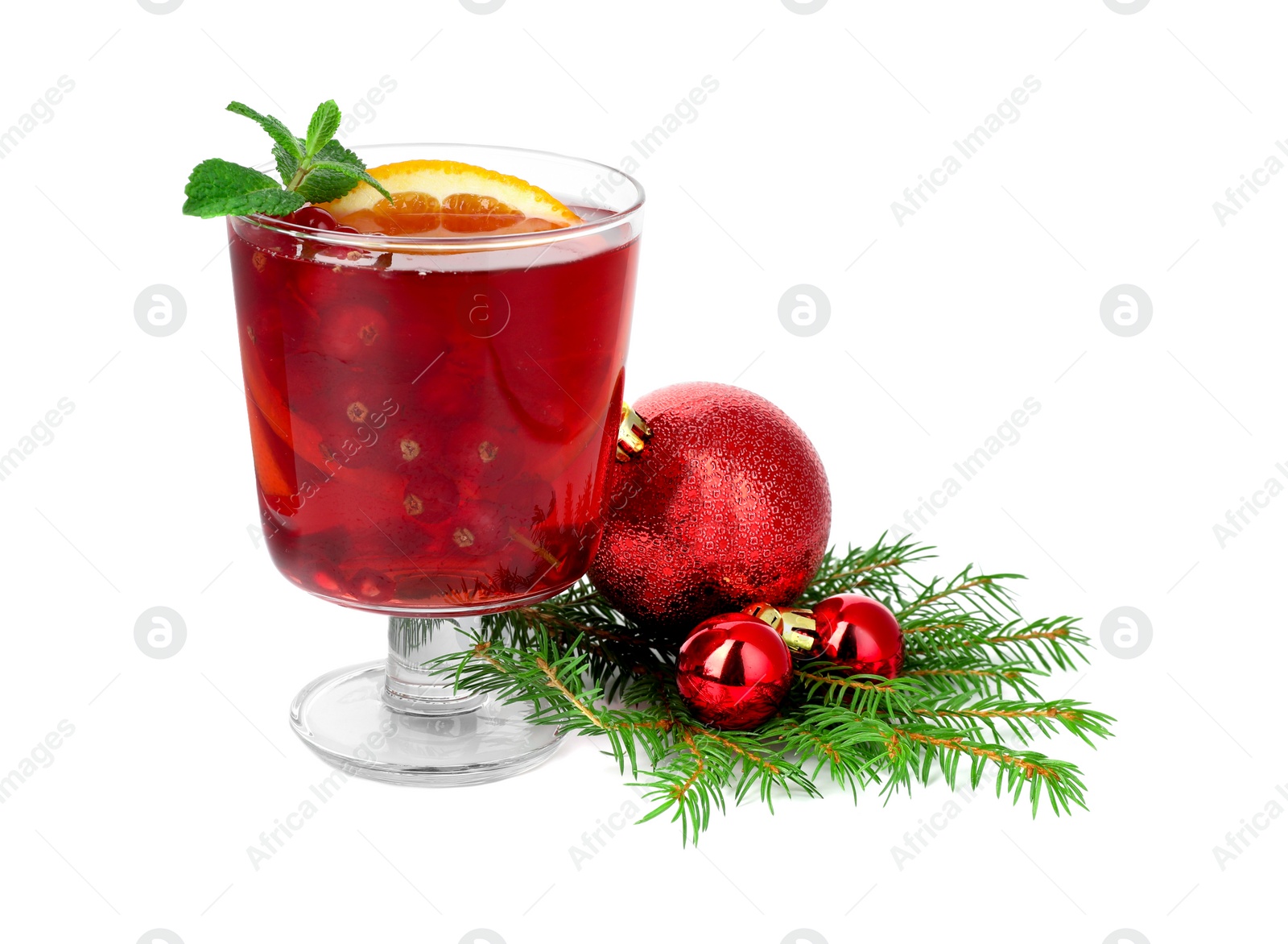 Photo of Aromatic Christmas Sangria in glass and festive decor isolated on white