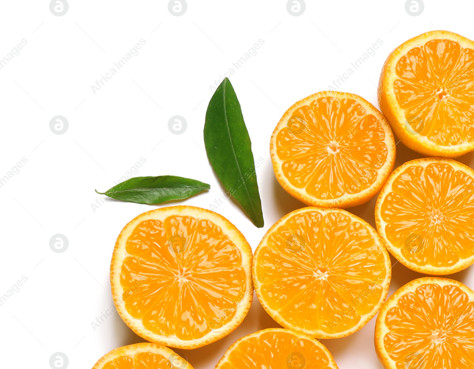 Photo of Composition with halves of fresh ripe tangerines and leaves on white background, top view. Citrus fruit