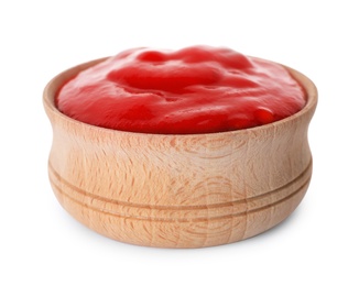 Photo of Wooden bowl with red sauce isolated on white