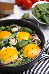 Photo of Tasty green Shakshouka served on table, closeup