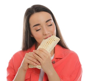 Young woman eating tasty shawarma isolated on white