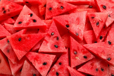 Photo of Delicious fresh watermelon slices as background, closeup