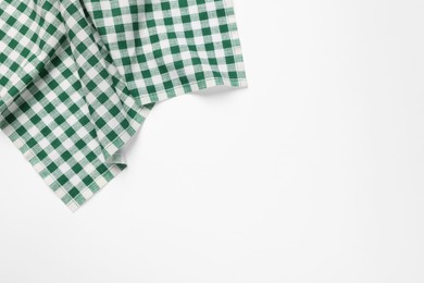 Photo of Green checkered tablecloth on white background, top view