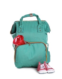 Photo of Maternity backpack with baby accessories on white background