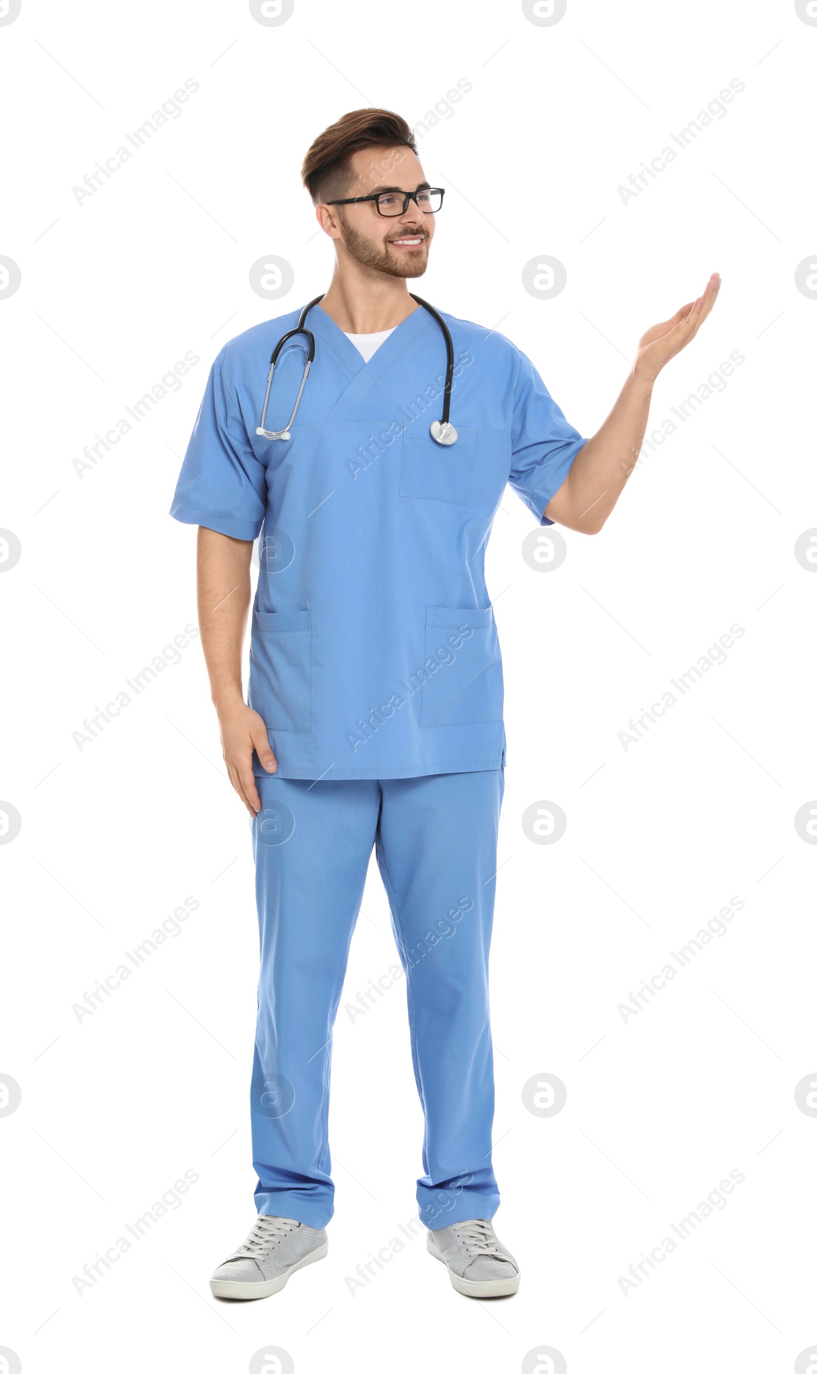 Photo of Full length portrait of medical doctor with stethoscope isolated on white